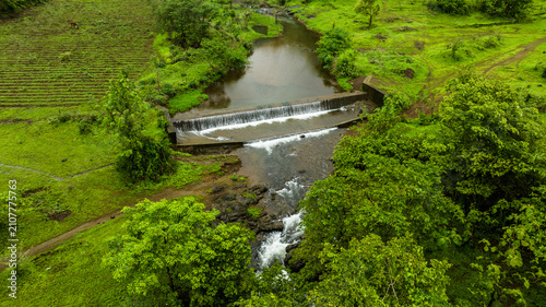 Bild auf Leinwand drone shot of Overflowing Stream in Monsoon,
Sahyadri Monsoon Landscape