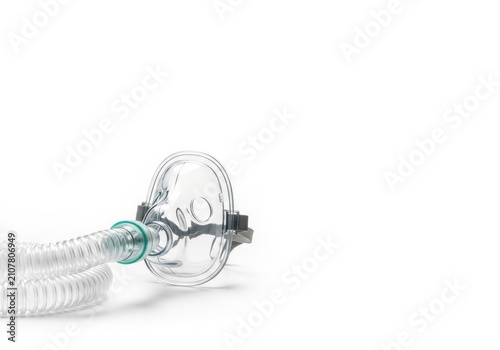 Medical oxygen mask with tube on white background.