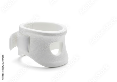 White ceramic mug with a unique handle design, isolated on a clean white background, showcasing its minimalist aesthetic and functional form.