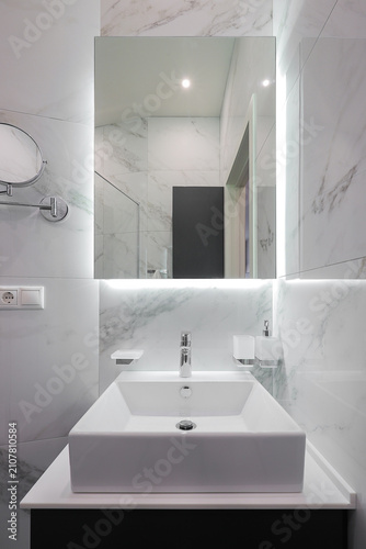 White bathroom sink with mirror