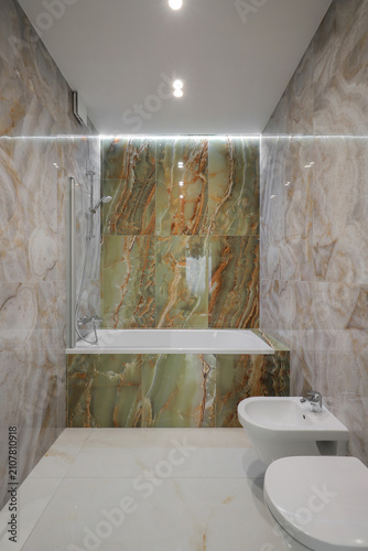 Bathroom interior with green onyx tiles