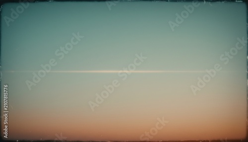 Vintage gradient sky background with a glowing horizon lens flare and copy space.