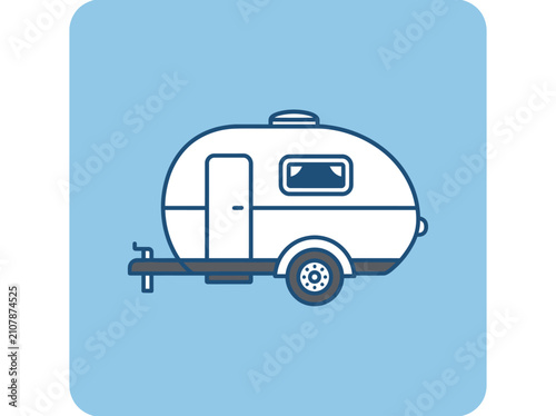 Small white vintage travel trailer.