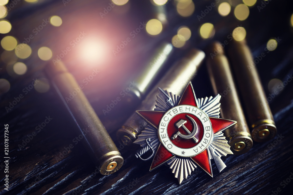 Fototapeta premium The Soviet order of the Second World war, Victory Day 9 May postcard concept, toned vintage