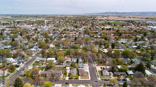 Εκτύπωση καμβά Aerial view of a dense residential neighborhood with tree lined streets stretching to the horizon
