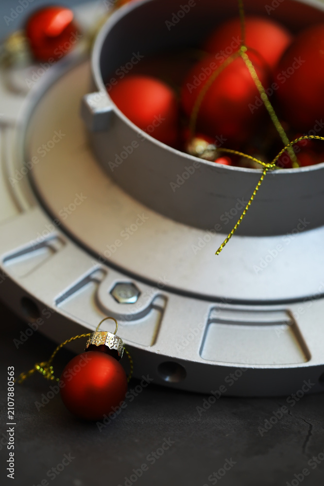 Fototapeta premium Festive Red Christmas Ornaments in Industrial Setting for Unique Holiday Decor