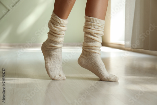 Womans legs in cozy beige k...