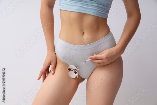 Young woman in panties with...