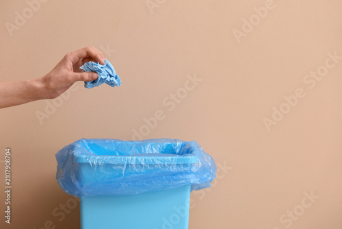 Woman throwing blue crumple...