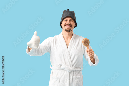 Handsome man in sauna felt ...