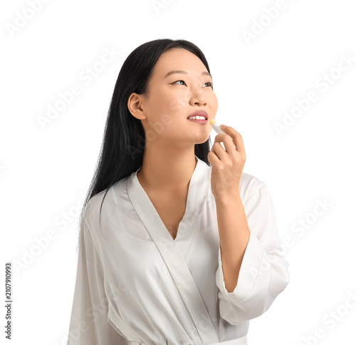Young Asian woman applying ...