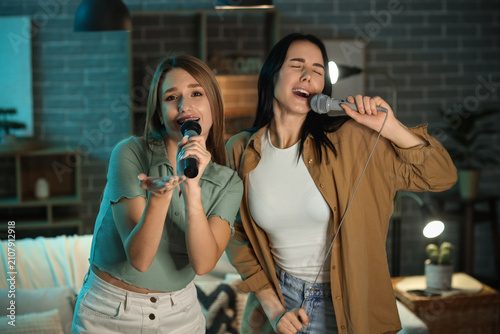 Pretty young women with mic...