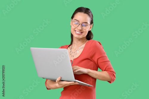 Young woman in eyeglasses u...