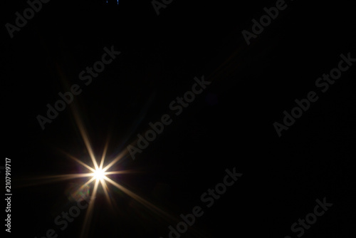 Sun flare on the black background