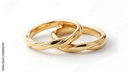 Pair of classical plain golden wedding bands isolated on white background for marriage and romance