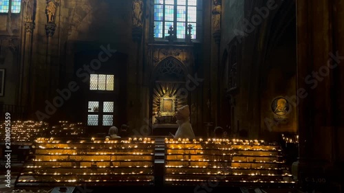 Prague, Czechia republic 17 june 2026 :Low angle view of ornate baroque church interior showcasing painted dome ceiling, altar, and golden decorative details. Majestic historic religious architecture.