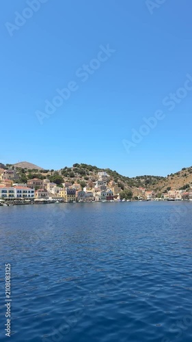 Panoramic view of the Mediterranean Sea, vibrant sapphire blue water, untouched coastline, calm atmosphere, bright summer sky, cinematic landscape