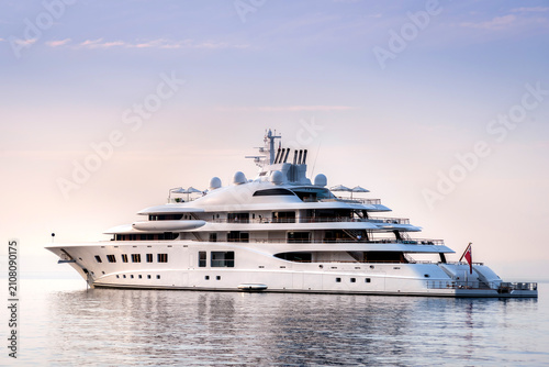 Private Mega yacht with a beautiful and expressive skyline in the horizon at anchor in the French Riviera 