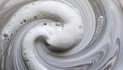Dynamic High Angle Shot Of Swirling White Foam Vortex Featuring Soft Motion Blur And Creamy Soap Bubbles Perfect For Skincare Cleaning Or Abstract Texture Backgrounds