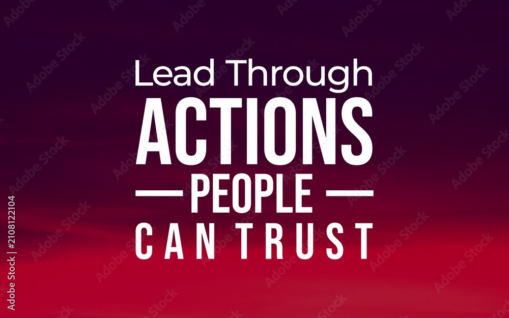 Obraz premium Leadership quote about earning trust through consistent actions, presented in bold white typography over a dramatic red and purple landscape background.