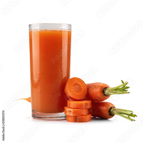 Fresh carrot juice in a tall glass with whole and sliced carrots during studio lighting isolated on transparent background