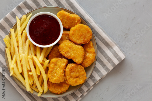 Fried Chicken Nuggets and French Fries with Sweet and Sour Sauce
