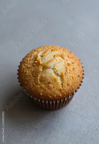 Single golden brown muffin ...