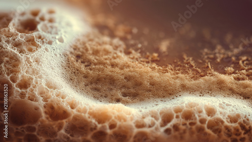 Close up of golden brown bubbly texture surface.