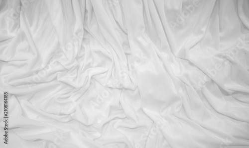 White crumpled fabric texture background. Top view. Copy space.