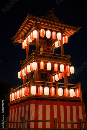 Bon dance festival tower with glowing lanterns night summer Japan no people