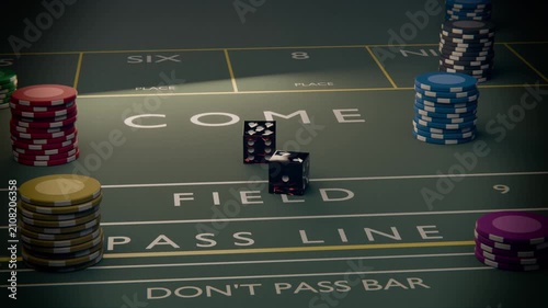 Rolling two black dice from toss, bouncing, turning, stopping on craps table with chips, COME or FIE