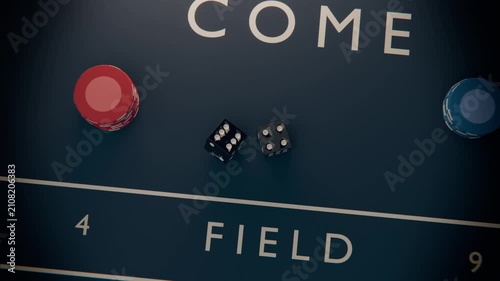 Throwing black dice with white pips tumbling across FIELD on craps table, settling three four