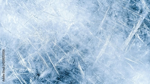 Close-up image of textured ice with visible cracks and frosty patterns in various shades of blue and white.