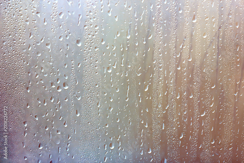 Light green gradient raindrops on glass abstract blurred background gentle summer soft green