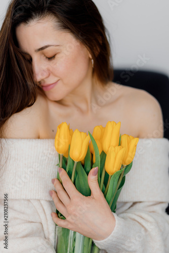 Woman Holding Yellow Tulips Bouquet