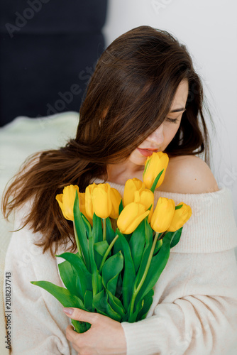 Woman Holding Yellow Tulips Bouquet