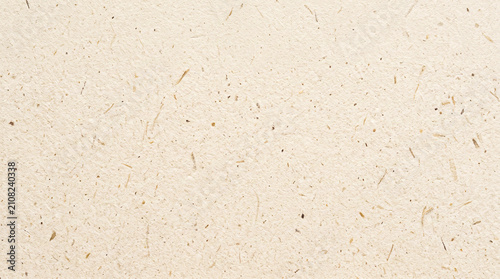 Minimalist paper texture with fine fibers and small specks creating a simple and clean background ideal for various artistic and design applications