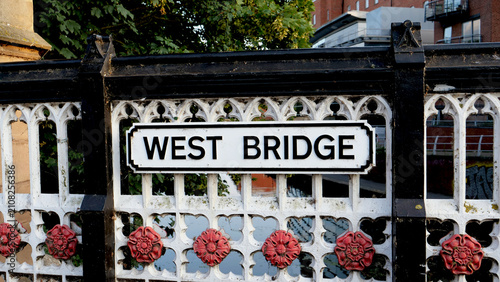 Vászonkép West Bridge, sign, Leicester historic cast iron bridge railing detail with red r