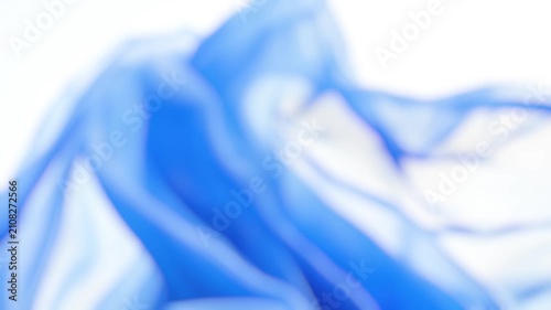 A close-up shot of a blue cloth with a blurred background