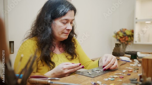 Professional jeweler creating custom handmade gemstone jewelry