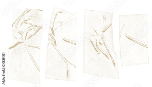 Vintage aged clear adhesive tape pieces with yellowed texture and glue residue.