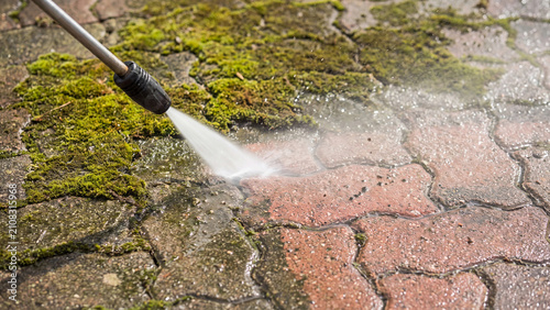Pressure washing and outdoor cleaning concept for patio maintenance moss removal driveway restoration and exterior surface care around the home