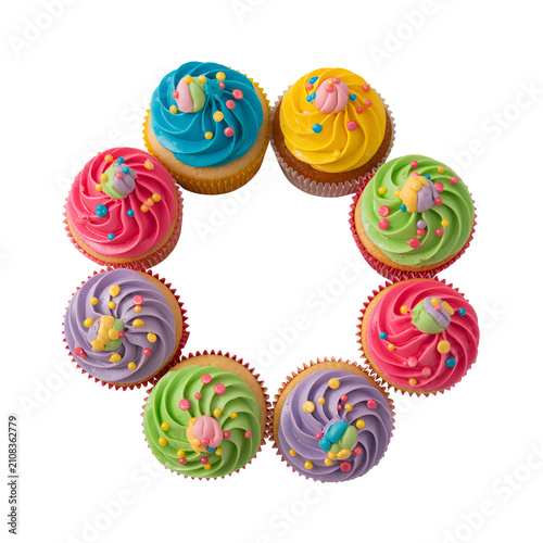 Colorful Birthday Donuts with Sprinkles Arranged in Circular Frame Isolated on White Background