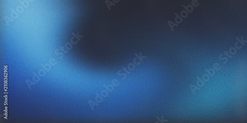 Cool abstract grainy texture background with dark gray and deep blue gradient colors creating a mesmerizing, blurry light leak effect