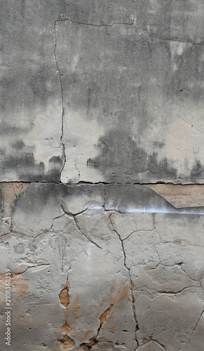 Canvas-taulu Vertical close up of a deteriorating concrete wall surface with weathered porous