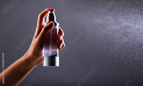 Fotografie Spray water with a spray bottle