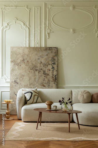 Elegant Living Room Interior with Neutral Sofa and Artistic Wall Decor in a Classic Setting, Cozy and Modern