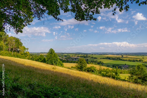 Slika na platnu Summer landscape, The terrain of hilly countryside, A hamlet on hillside with gr