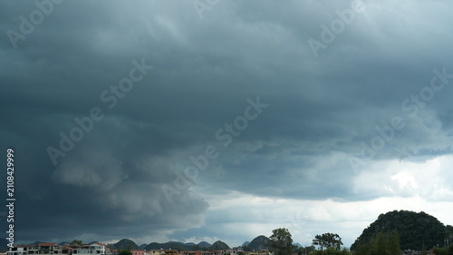 The dark cloudy sky view before the heavy rain and storm in summer
