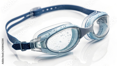Swimming goggles with blue strap and clear lenses with water droplets